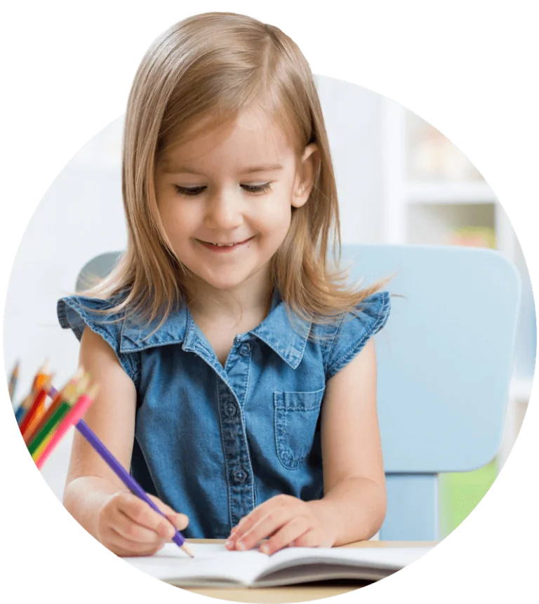Young blonde girl coloring with colored pencils.