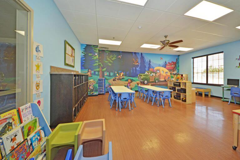 childcare classroom with tables and chairs